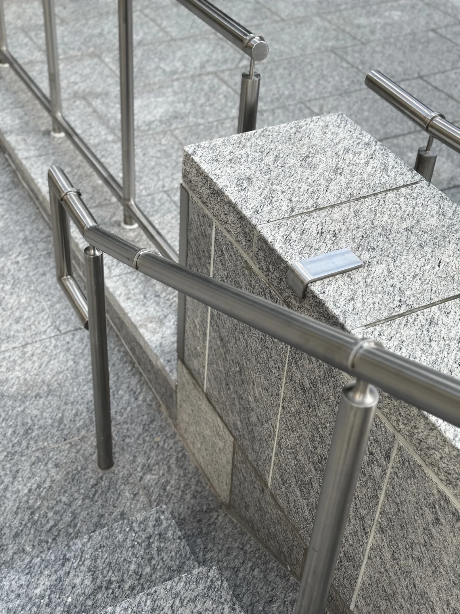 Skateboard Deterrents for Handrails installed in a Canadian commercial setting — stainless skateboard deterrent hardware